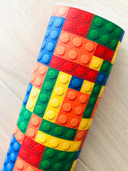 Printed Pebbled Faux Leather with a Lego Design