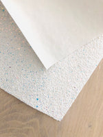 Iridescent White Chunky Glitter Fabric - White Canvas Backing